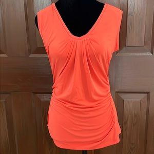NWOT New York & Company women’s size small orange body hugging top.